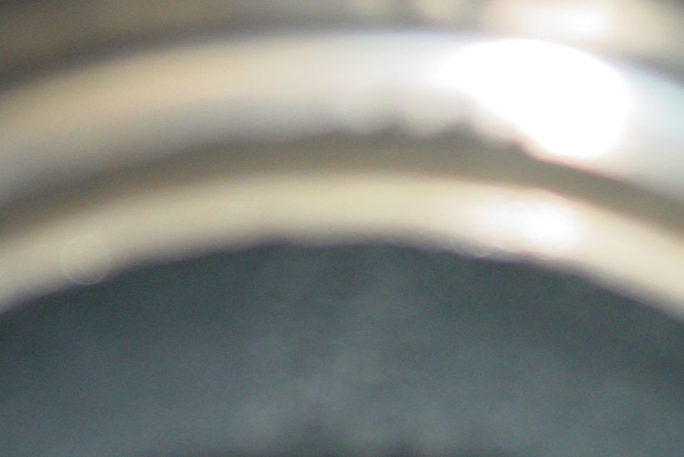 Blurry interior shot with bright light source and curved surfaces