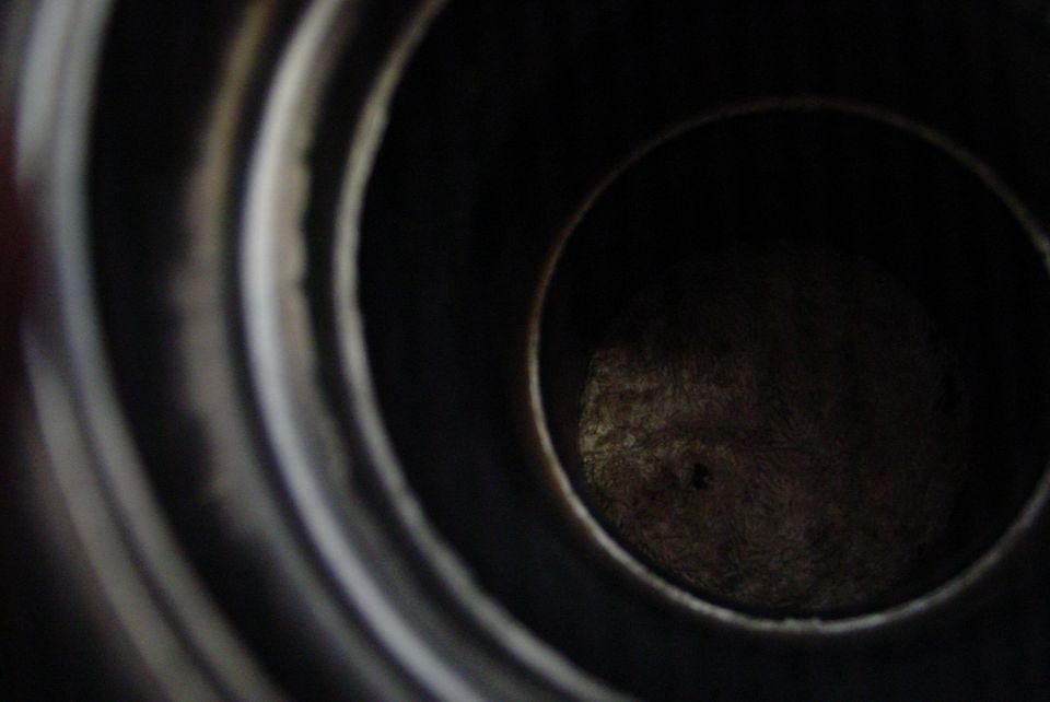 Close-up of engine cylinder interior with Supermotors.net watermark
