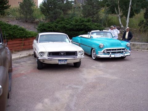 1972 Ford Ranchero - White 1967 Ford Mustang and a turquoise convertible are parked side-by-side.