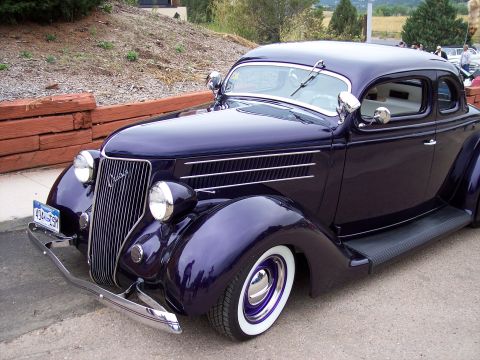 1972 Ford Ranchero - This 1935 Ford coupe features a distinctive chrome grille and whitewall tires.