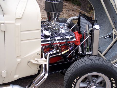 1972 Ford Ranchero - Close-up of a custom V8 engine with chrome accents and headers, installed in a cream-colored vehicle.