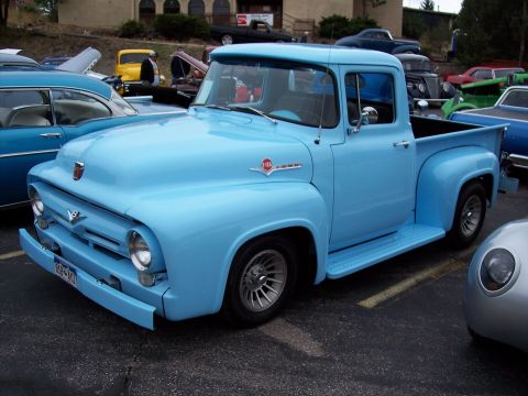 1972 Ford Ranchero - A classic light blue Ford pickup truck is parked in a lot with other vehicles visible.