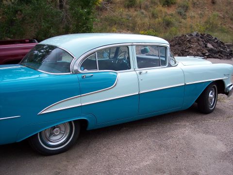 1972 Ford Ranchero - This two-tone blue and light blue 1955 Oldsmobile 88 sedan features a distinctive side trim and chrome accents.