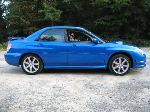 2007 Subaru Impreza - Side profile of a blue 2007 Subaru Impreza WRX sedan with a rear spoiler.