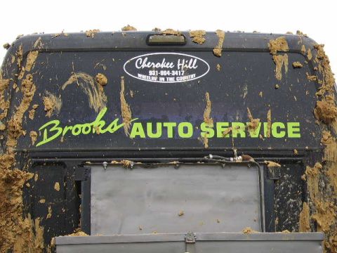 1986 Ford Ranger - Mud-covered van with "Brooks AUTO SERVICE" and "Cherokee Hill" decals.