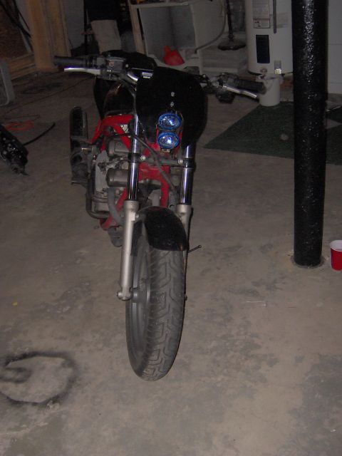 1993 Yamaha Seca II - Motorcycle parked indoors, showing its front end with exposed engine components.