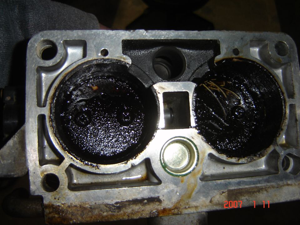 Throttle body with heavy carbon buildup and debris inside