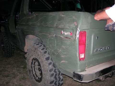 1978 Ford Bronco - This 1978 Ford Bronco shows extensive damage to its rear quarter panel, highlighting its history.