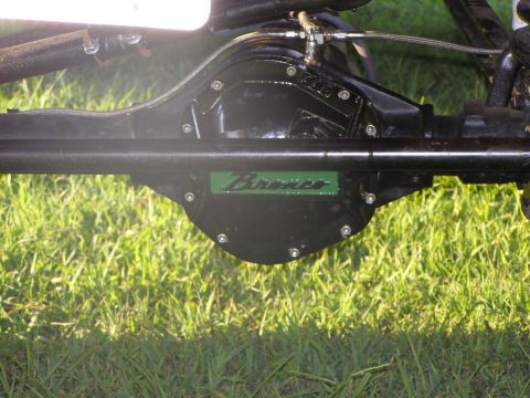 1993 Ford Bronco - This image shows a close-up of the rear axle assembly of a Ford Bronco, the distinctive green emblem.