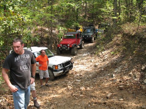 1993 Ford Bronco - The party standing around waiting for the Rovers to climb a muddy little hill.
