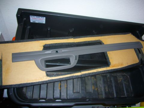 2000 Ford Crown Victoria - Interior trim piece from a vehicle, possibly a Ford Crown Victoria, shown in a trunk organizer.