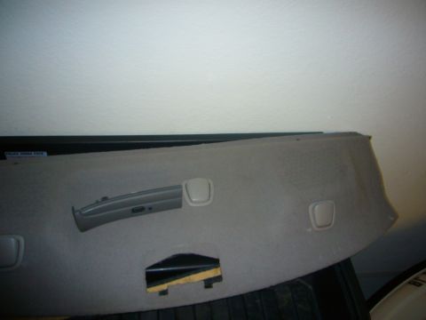 2000 Ford Crown Victoria - A close-up view of a car's interior panel, revealing its construction and components.
