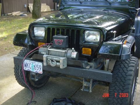 1989 Ford Bronco - Its a Warn M8000 winch, roller fairlead, and winch mount for a YJ