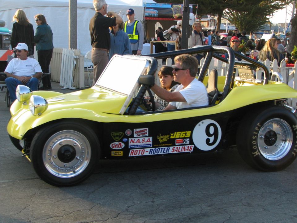 Yellow dune buggy with racing decals and number 9