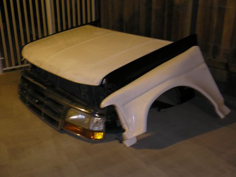 1990 Ford Bronco - Hood and fender assembly from a 1990 Ford Bronco, likely for repair or customization.