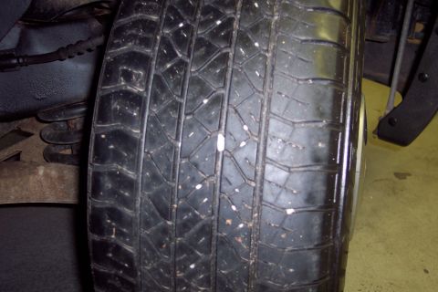 2001 Ford Crown Victoria - Close-up view of a tire, showing its tread and sidewall details.