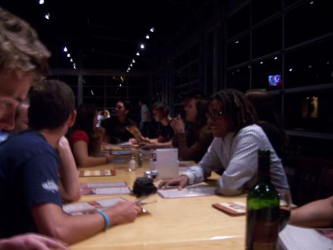 1991 Ford Bronco - Diners seated at tables in a restaurant at night, with lights reflecting in the windows.