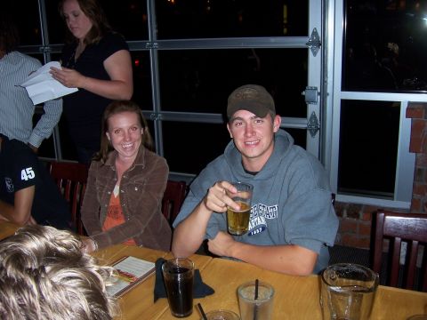 1991 Ford Bronco - People gathered around a table with drinks, enjoying an evening out.