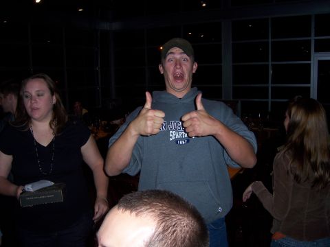 1991 Ford Bronco - People celebrating at an indoor event, with one man giving a double thumbs-up.