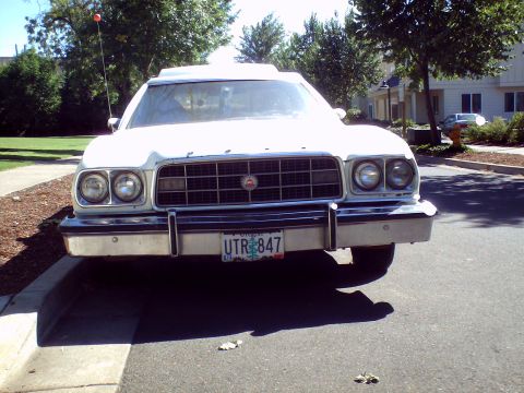 1973 Ford Ranchero - Frontal view of a white 1973 Ford Ranchero, identifiable by its grille and front-end styling.