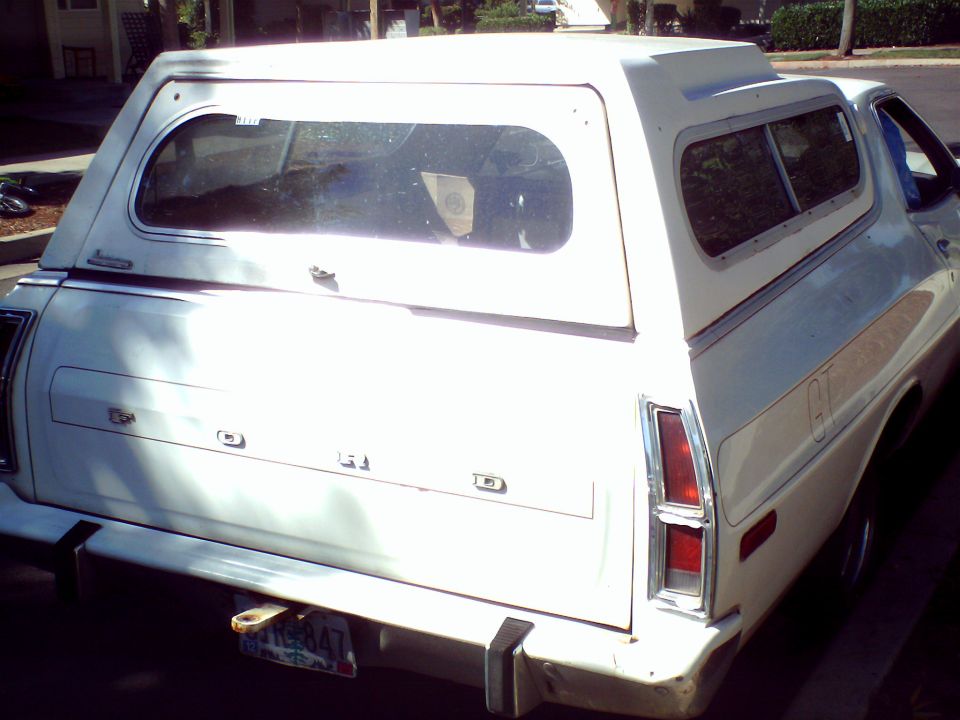 1973 Ford Ranchero rear view with camper shell, white paint, GT stripe visible on side