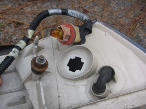 2000 Ford Crown Victoria - Close-up of a vehicle's tail light assembly, showing internal components and wiring.