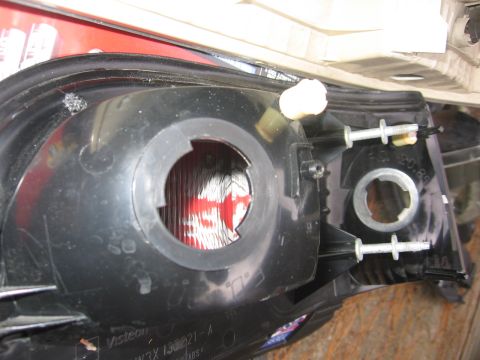 2000 Ford Crown Victoria - Close-up of a vehicle's taillight assembly, showing the internal structure and mounting points.