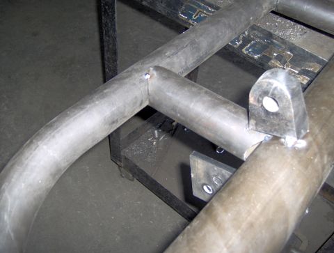 1978 Ford Bronco - Close-up view of a fabricated metal tubing structure, possibly part of a custom vehicle modification.