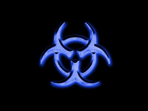 1990 Ford Bronco - A neon blue biohazard symbol glows against a dark background.
