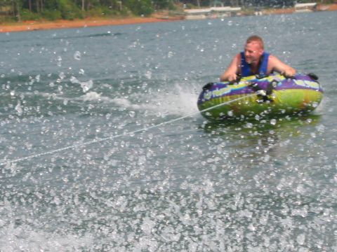 1985 Ford LTD Crown Victoria - A person enjoys tubing on a sunny day at Lake Hartwell, SC.