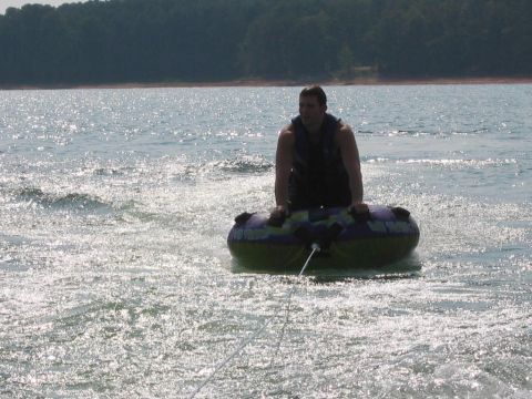 1985 Ford LTD Crown Victoria - A person enjoys tubing on a sunny day at Lake Hartwell, SC.