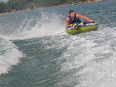 1985 Ford LTD Crown Victoria - A person enjoys tubing behind a boat on Lake Hartwell, SC on a sunny day.