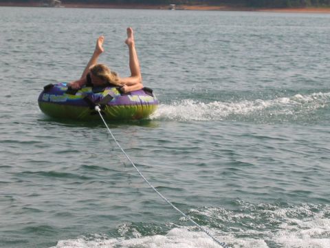 1985 Ford LTD Crown Victoria - A person enjoys tubing on a sunny day at Lake Hartwell.