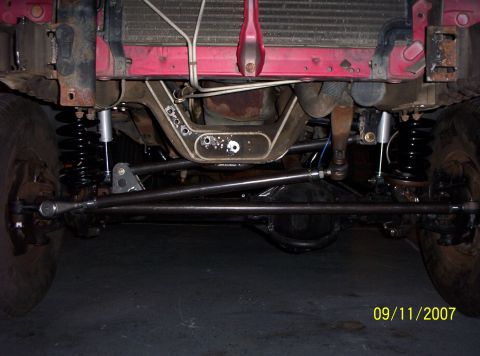 1995 Ford Bronco - This photo shows the front suspension and drivetrain of a vehicle, likely undergoing modifications or repairs.