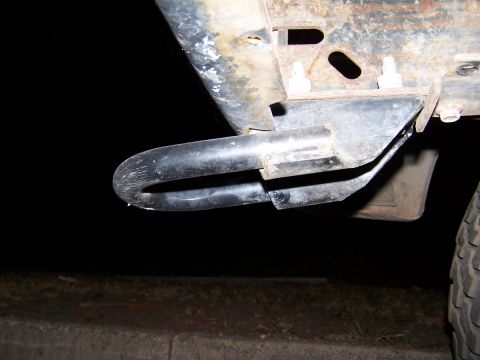 1990 Ford Bronco - A close-up view of a tow hook on a vehicle's frame.