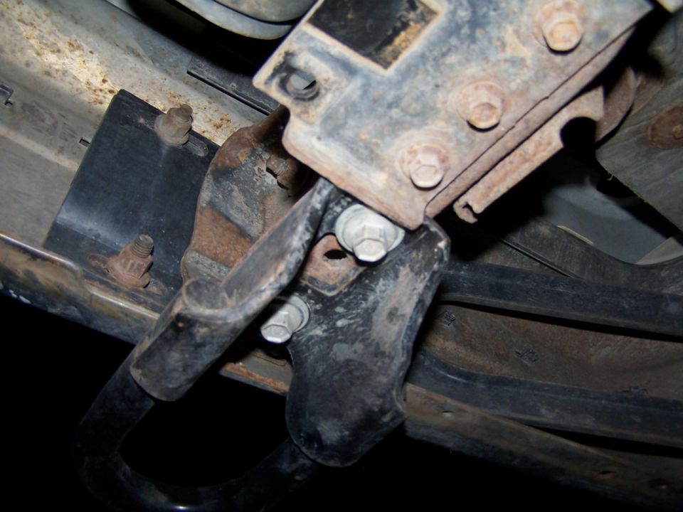 Tow hook bracket with bolts and rust