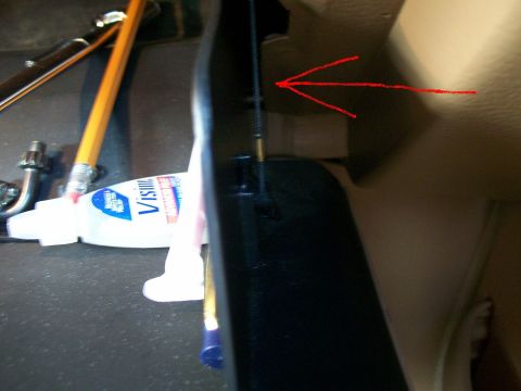 1995 Mercury Grand Marquis - Interior trim piece with tools and adhesive, likely part of a repair or modification.
