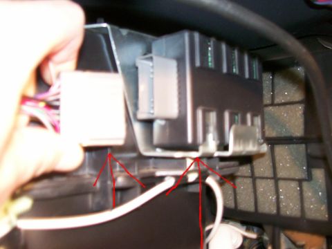 1995 Mercury Grand Marquis - A hand is shown near an electrical component, with red arrows indicating connection points.