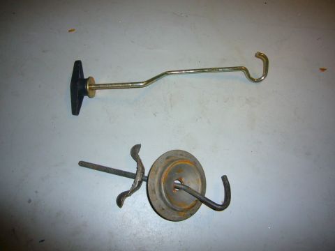 2000 Ford Crown Victoria - Two metal hooks, one with a black T-handle, are shown against a gray background.