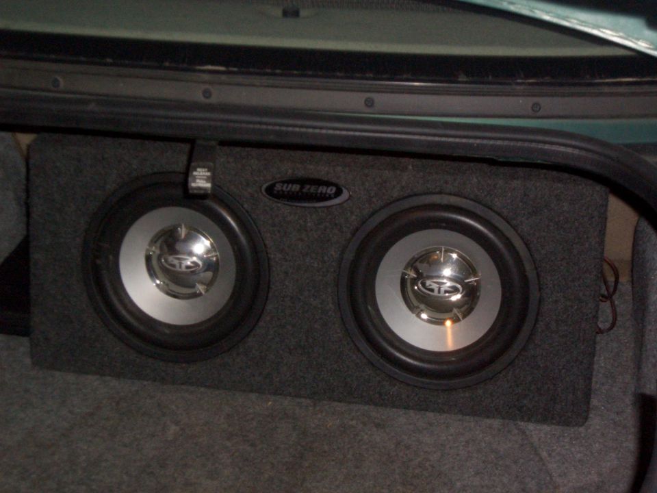 Two Sub Zero subwoofers in a carpeted enclosure box