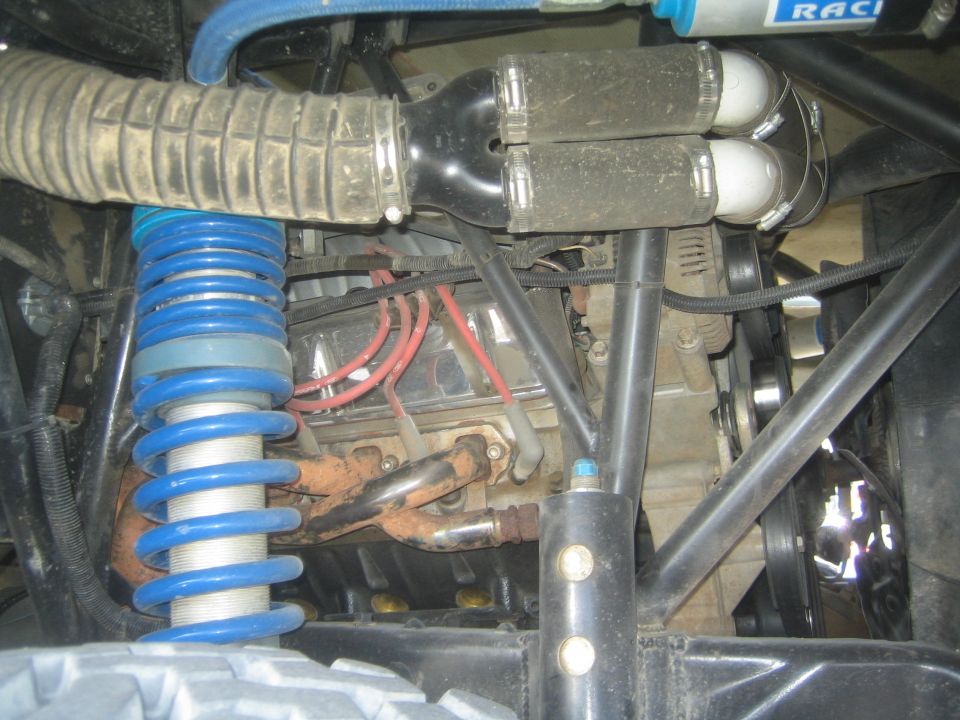 Underhood engine bay with blue coil spring, header and tube chassis