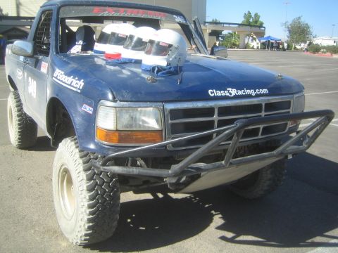 1990 Ford Bronco - dark blue Ford Bronco off-road racer #349 with white helmets on the cowl, Class3Racing.com lettering and a tubular front bumper.