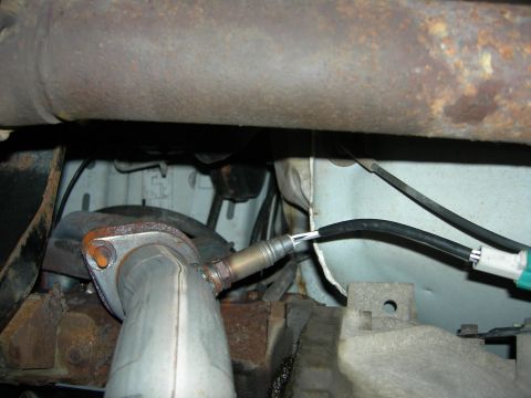 1996 Ford Bronco - Close-up view of a vehicle's exhaust system component, including an oxygen sensor.