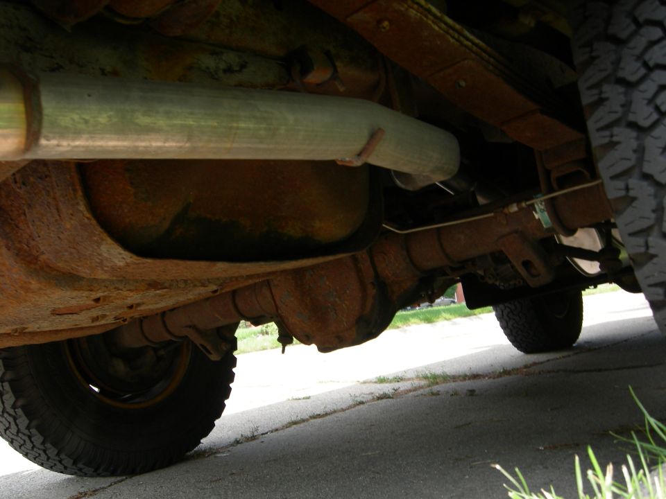 Underbody view of exhaust pipe and suspension components