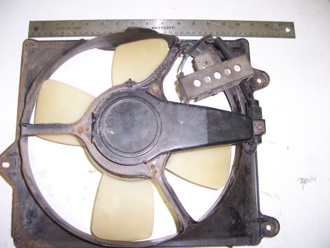 1991 Ford Bronco - Radiator fan assembly shown with a ruler for scale.