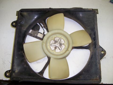 1991 Ford Bronco - A radiator fan assembly is shown, a central hub and motor housing.