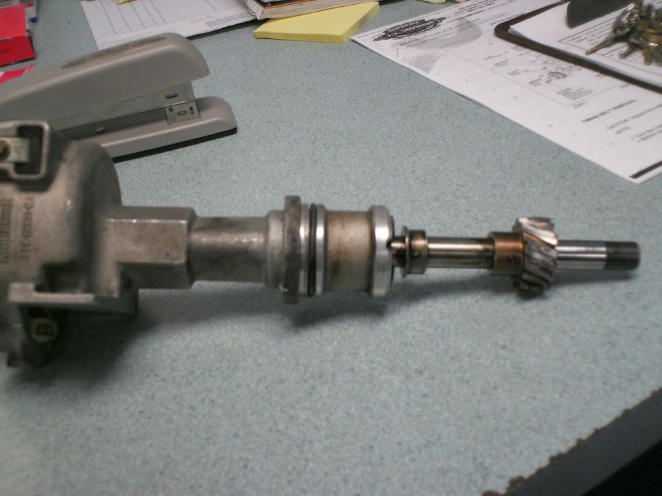 Disassembled engine distributor lying on a desk