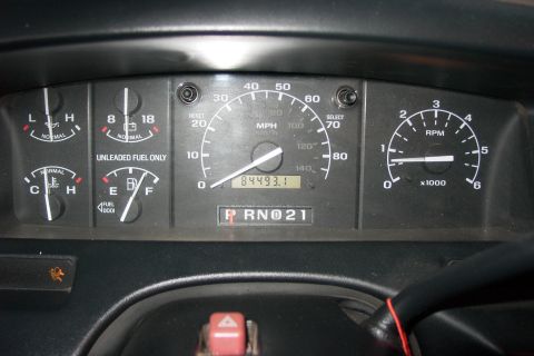 1996 Ford Bronco - Interior view of dashboard gauges, including speedometer, tachometer, fuel, oil, temperature, and battery indicators.