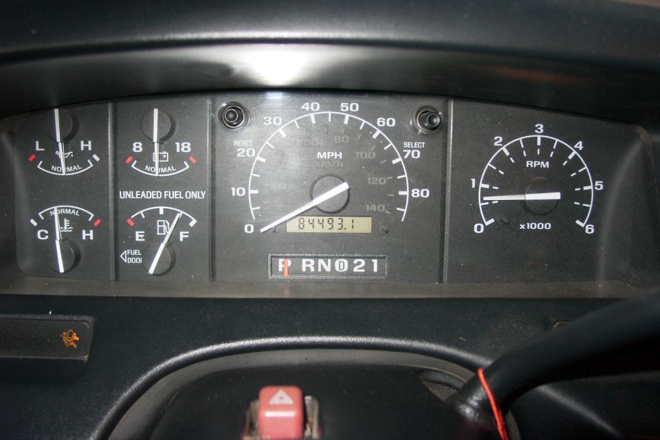 Dashboard gauges with odometer reading 84493.1 and PRND21 gear indicator