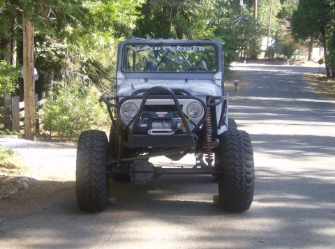 1986 Ford Bronco - This heavily modified Toyota Land Cruiser FJ40 features a prominent winch and off-road tires.
